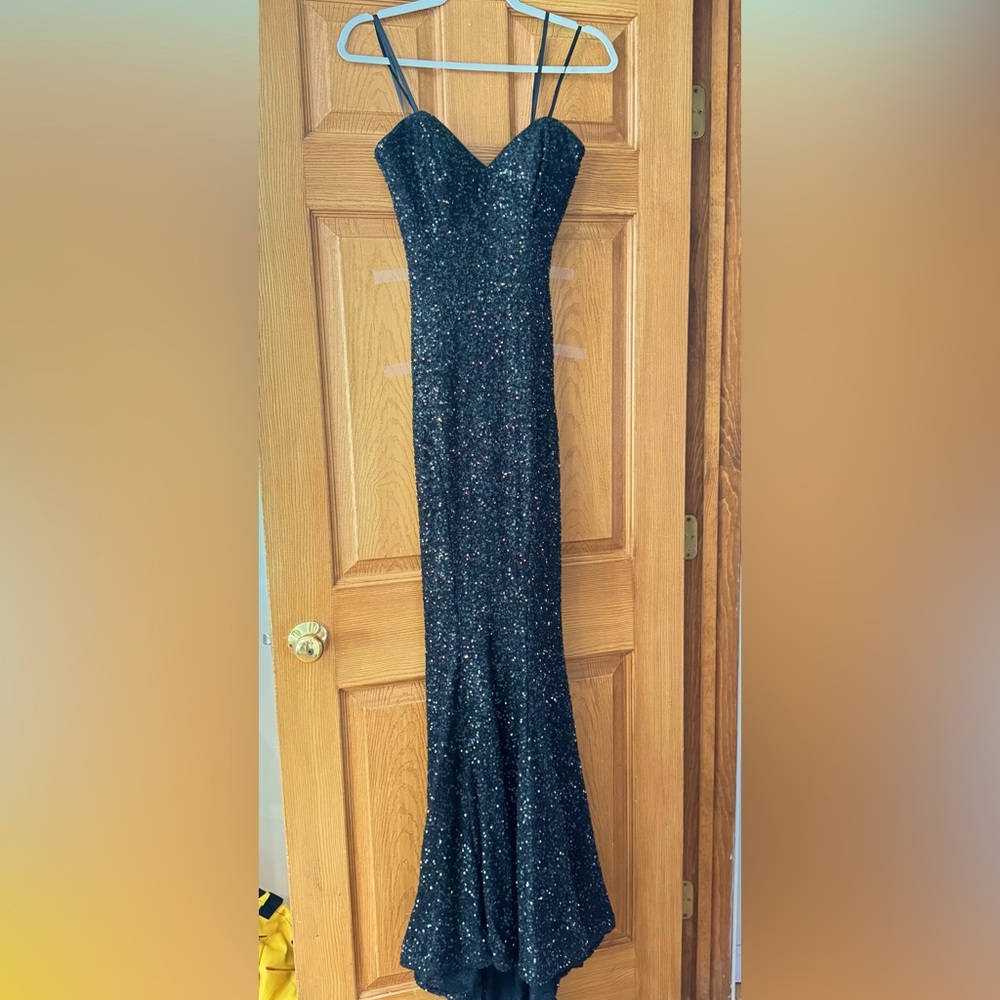 “La Femme” Black sequins gown.